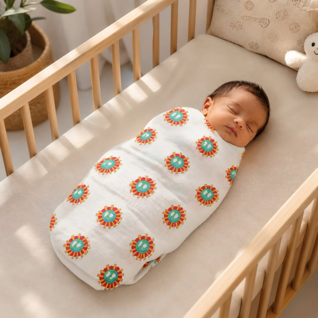 Hand block printed cotton swaddles in a sunburst and polka dot print
