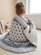 PEXX blue tiger print reversible cotton baby quilt, 100 x 100 cm — child wrapped lifestyle