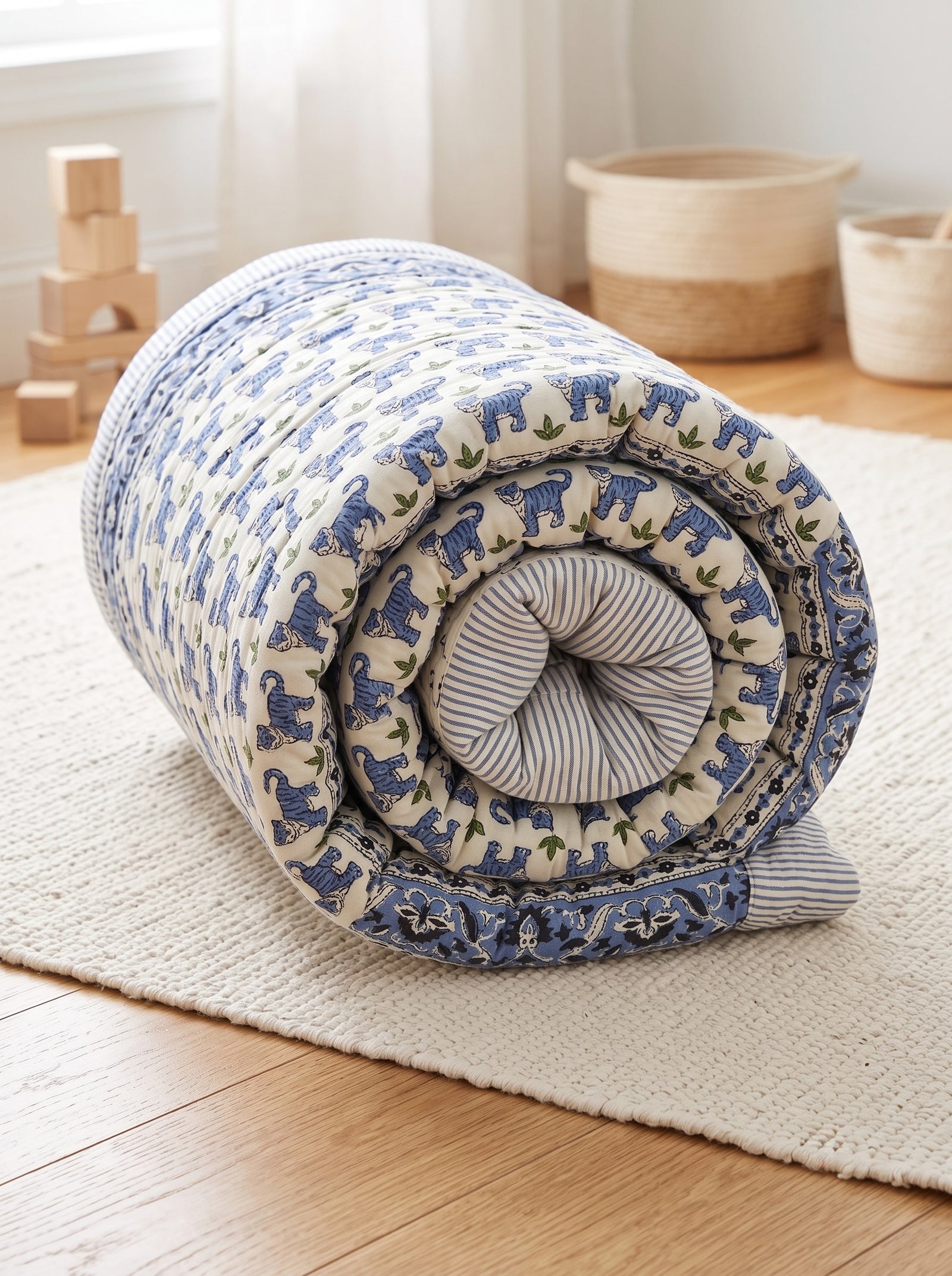 PEXX blue tiger print reversible cotton baby quilt, 100 x 100 cm — rolled quilt detail