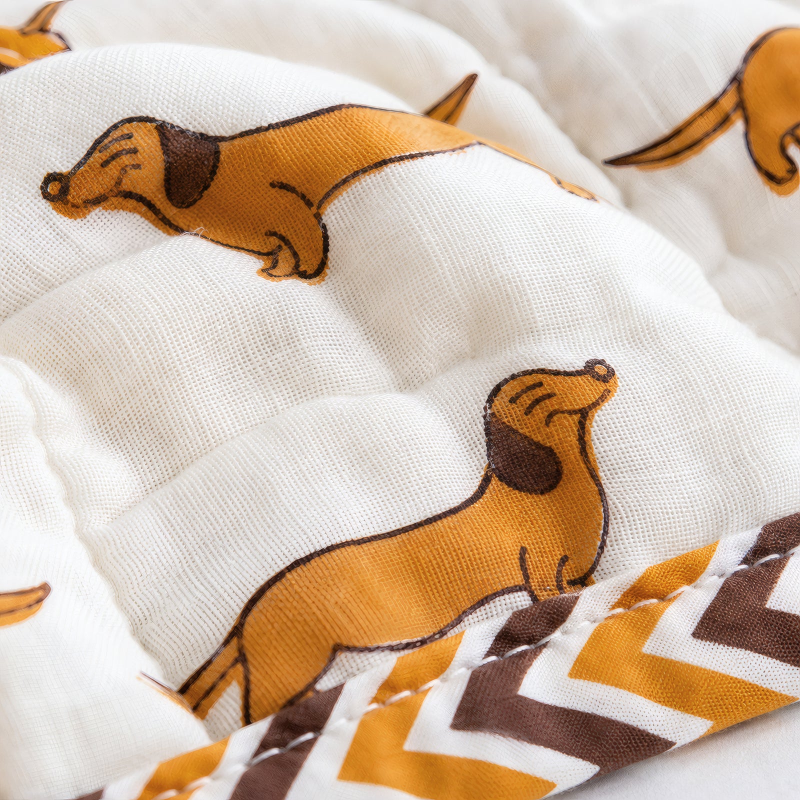 PEXX orange dachshund print reversible cotton baby quilt, 100 x 100 cm — dachshund print close up