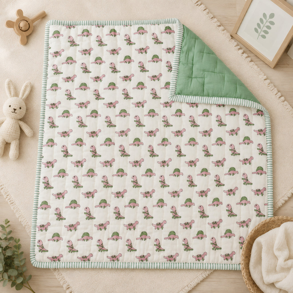 PEXX pink dino print reversible cotton baby quilt, 100 x 100 cm — hero full quilt