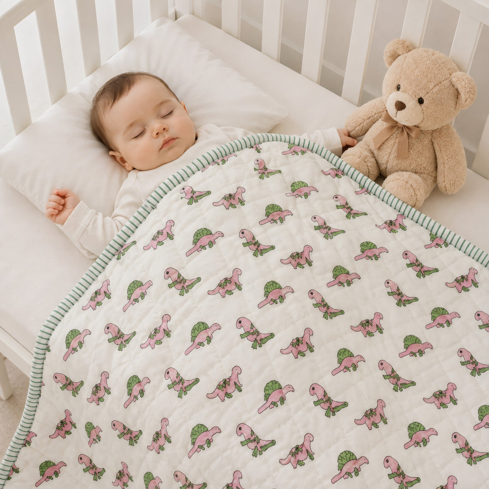 PEXX pink dino print reversible cotton baby quilt, 100 x 100 cm — baby nap lifestyle