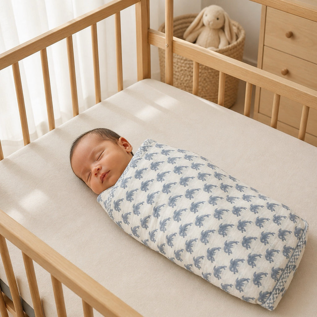 Unicorn & Dolphin print hand block-printed cotton muslin baby swaddle set – print B on-baby