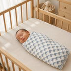 Unicorn & Dolphin print hand block-printed cotton muslin baby swaddle set – print B on-baby