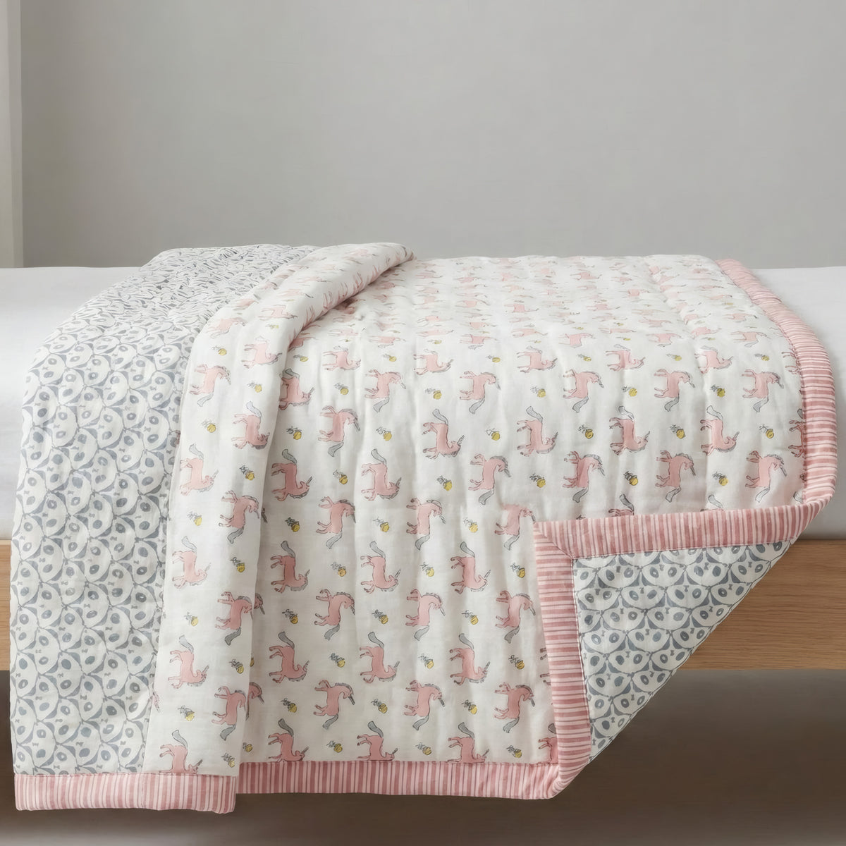 Blush Pony print hand block-printed reversible cotton voile kids quilt (razai) – lifestyle - bed