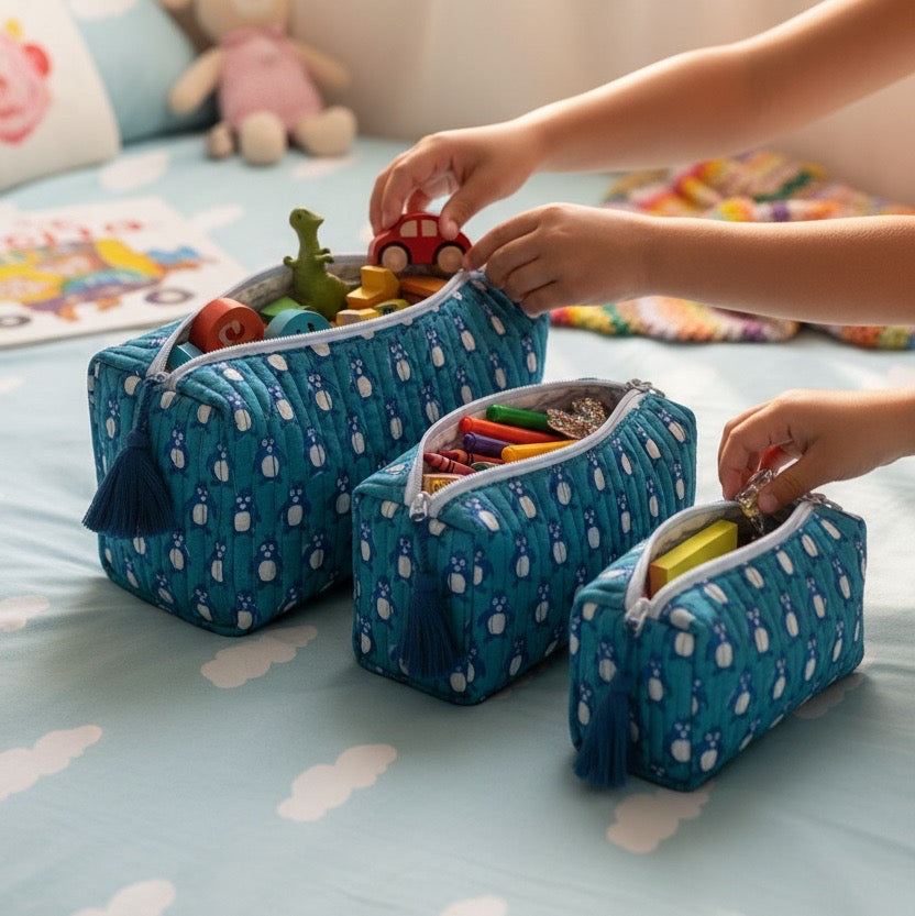Teal Penguin print hand block-printed cotton toiletry pouch set – hero — set together, use 1