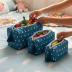 Teal Penguin print hand block-printed cotton toiletry pouch set – hero — set together, use 1