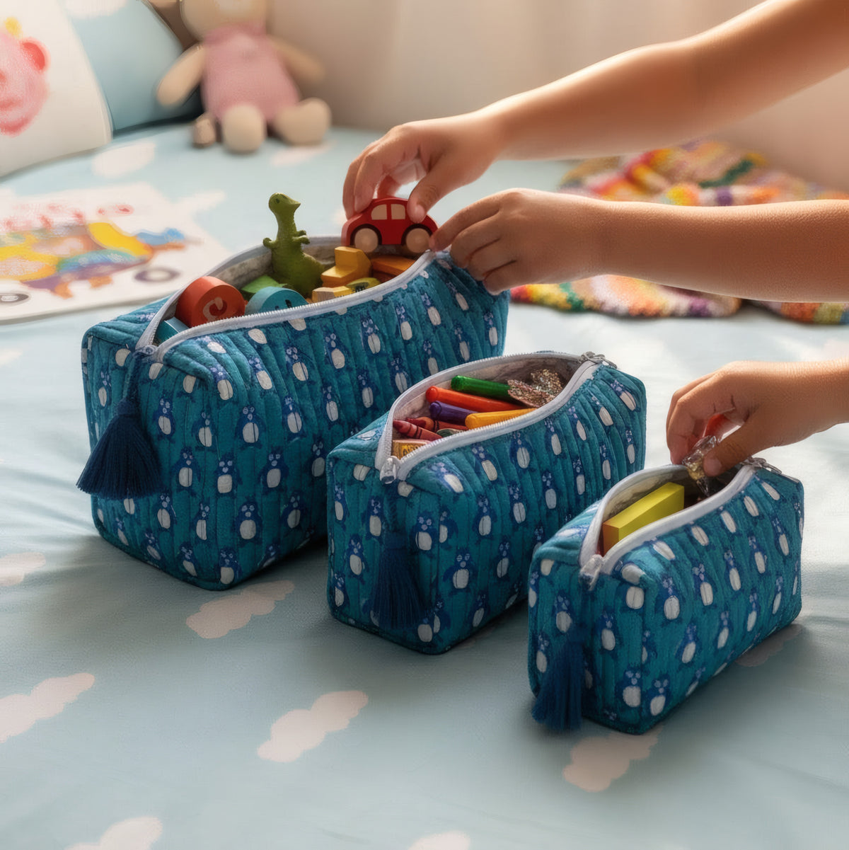 Teal Penguin print hand block-printed cotton toiletry pouch set – hero — set together, use 1